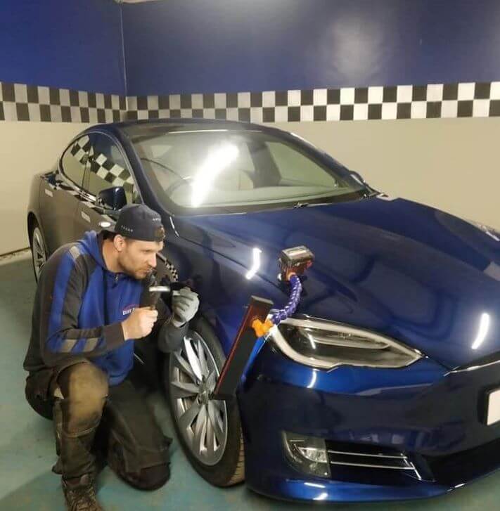 Darius Repairing Car Dent